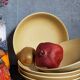 Five vintage natural stoneware soup plates