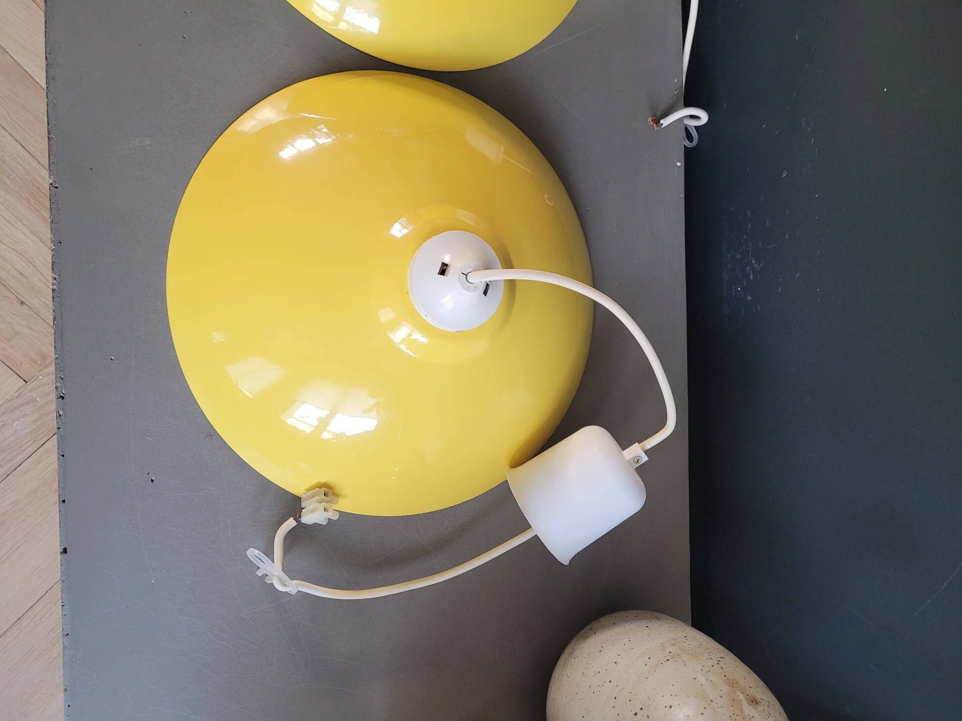 Pair of yellow lacquered metal pendant lights