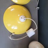 Pair of yellow lacquered metal pendant lights