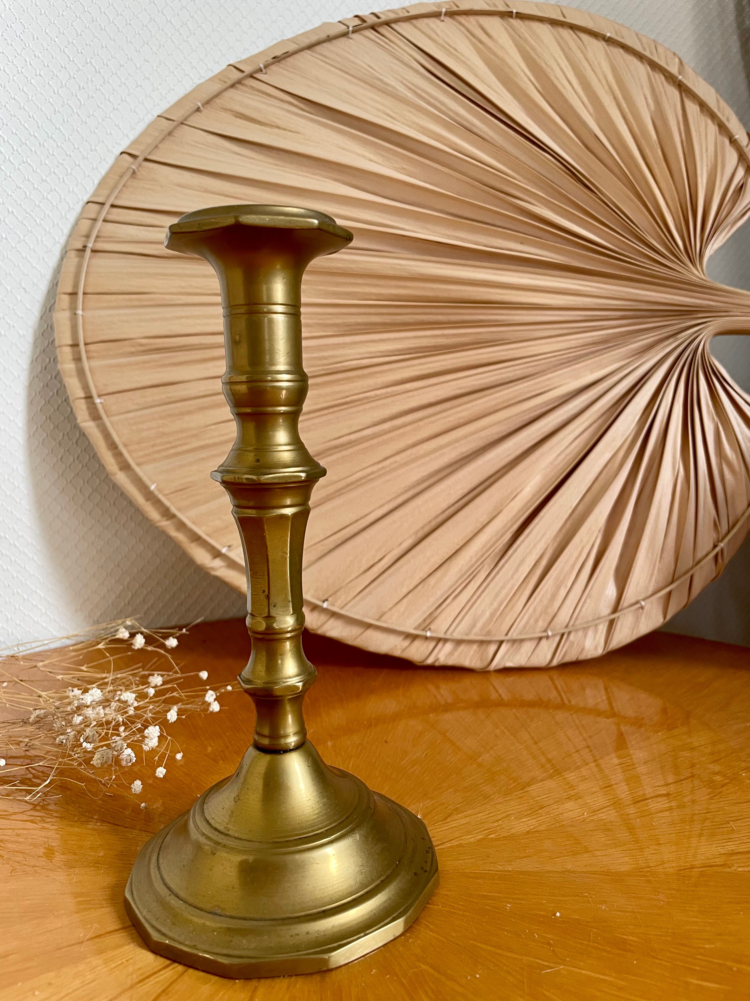 Old brass torch candle holder