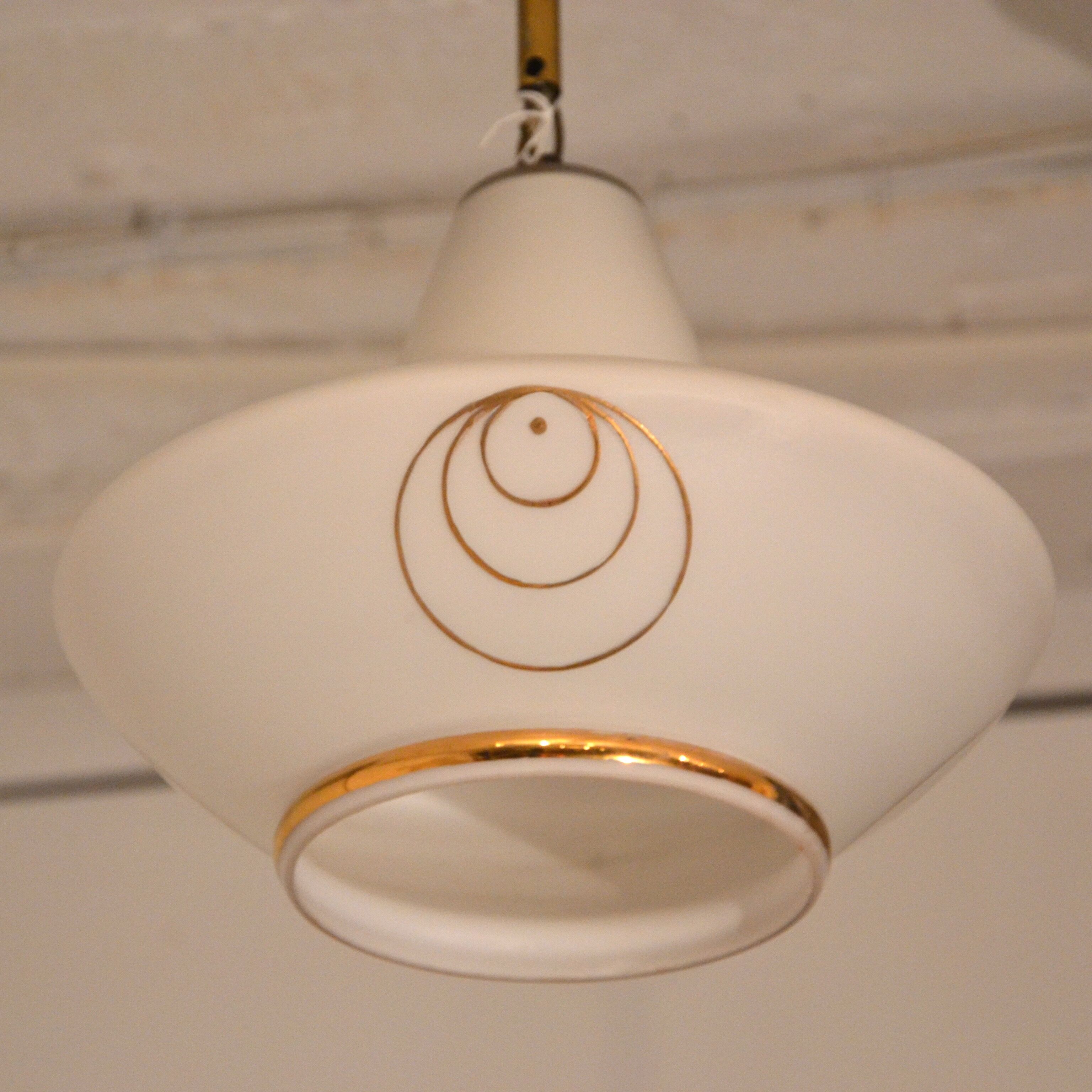 White and gold suspension