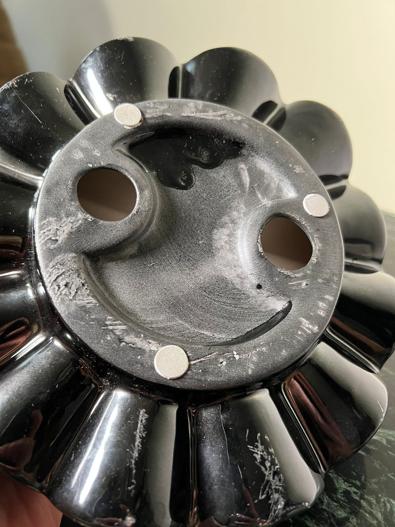 Empty pocket black glazed ceramic ashtray, 1970