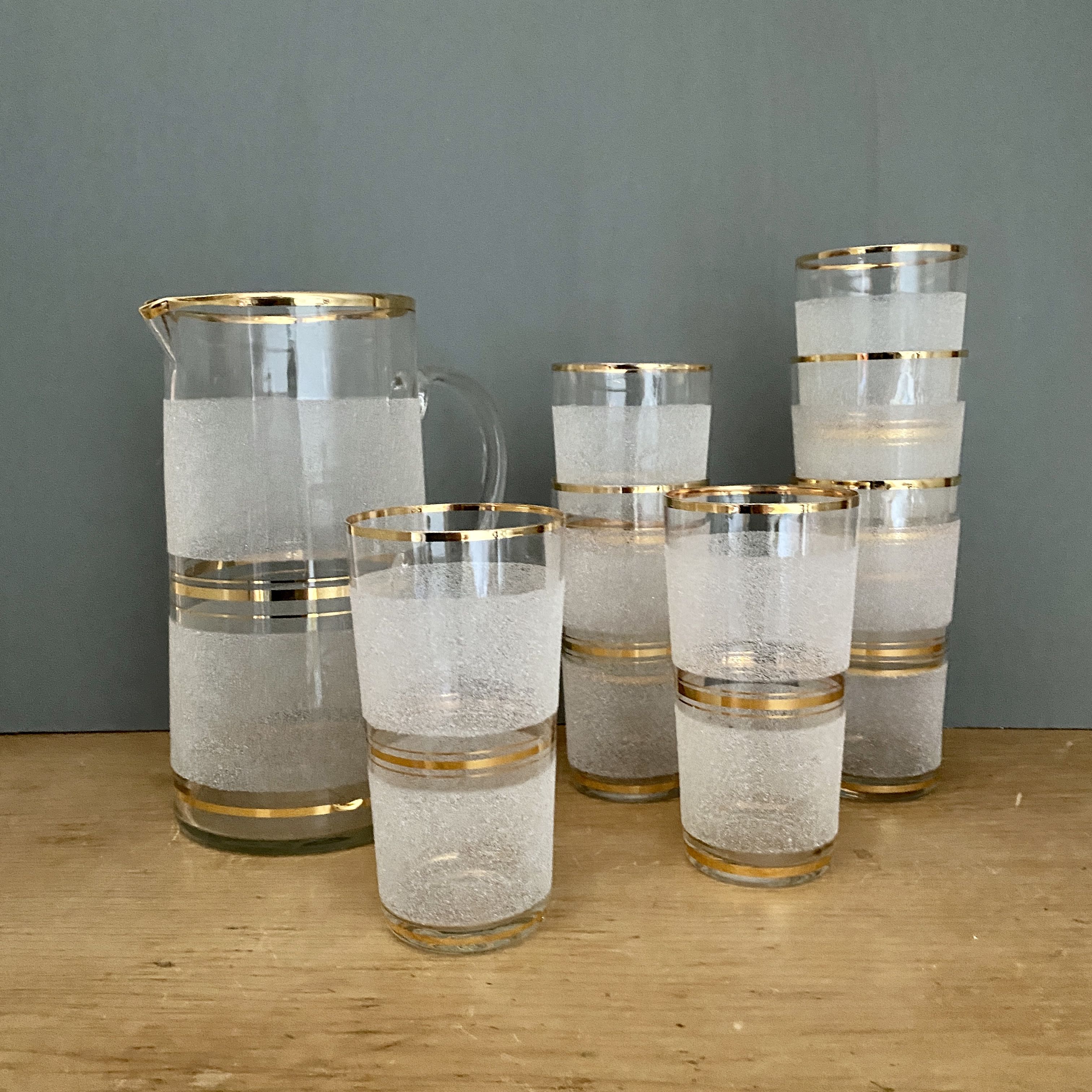 Vintage orangeade service in white granite glass and golden edging