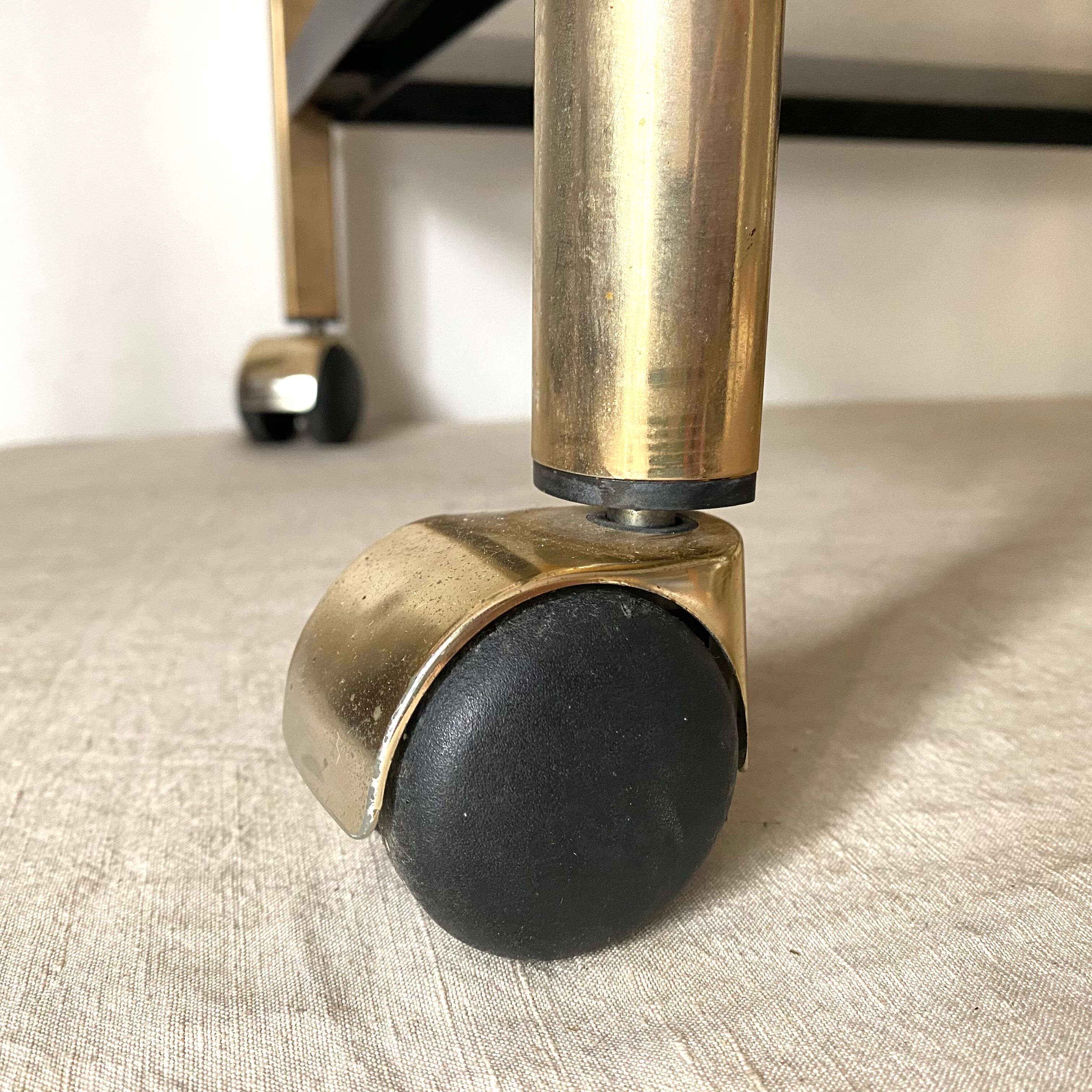 Serving with vintage wheels in metal and smoked glass