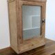 Small glass wall cabinet from the 1960s.