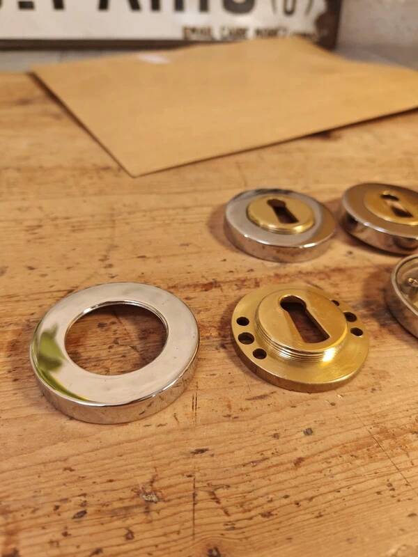 Rare vintage metal door lock fittings in gold and silver.