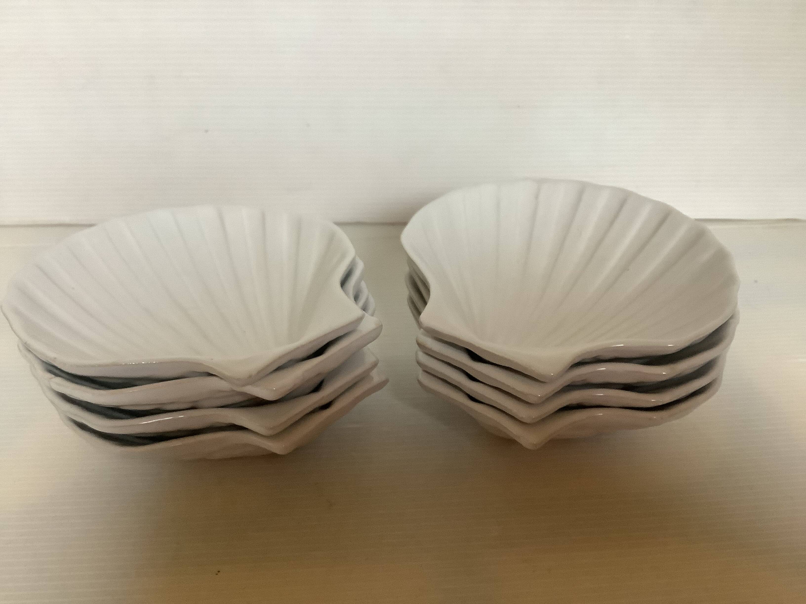 Eight white scallop shell bowls