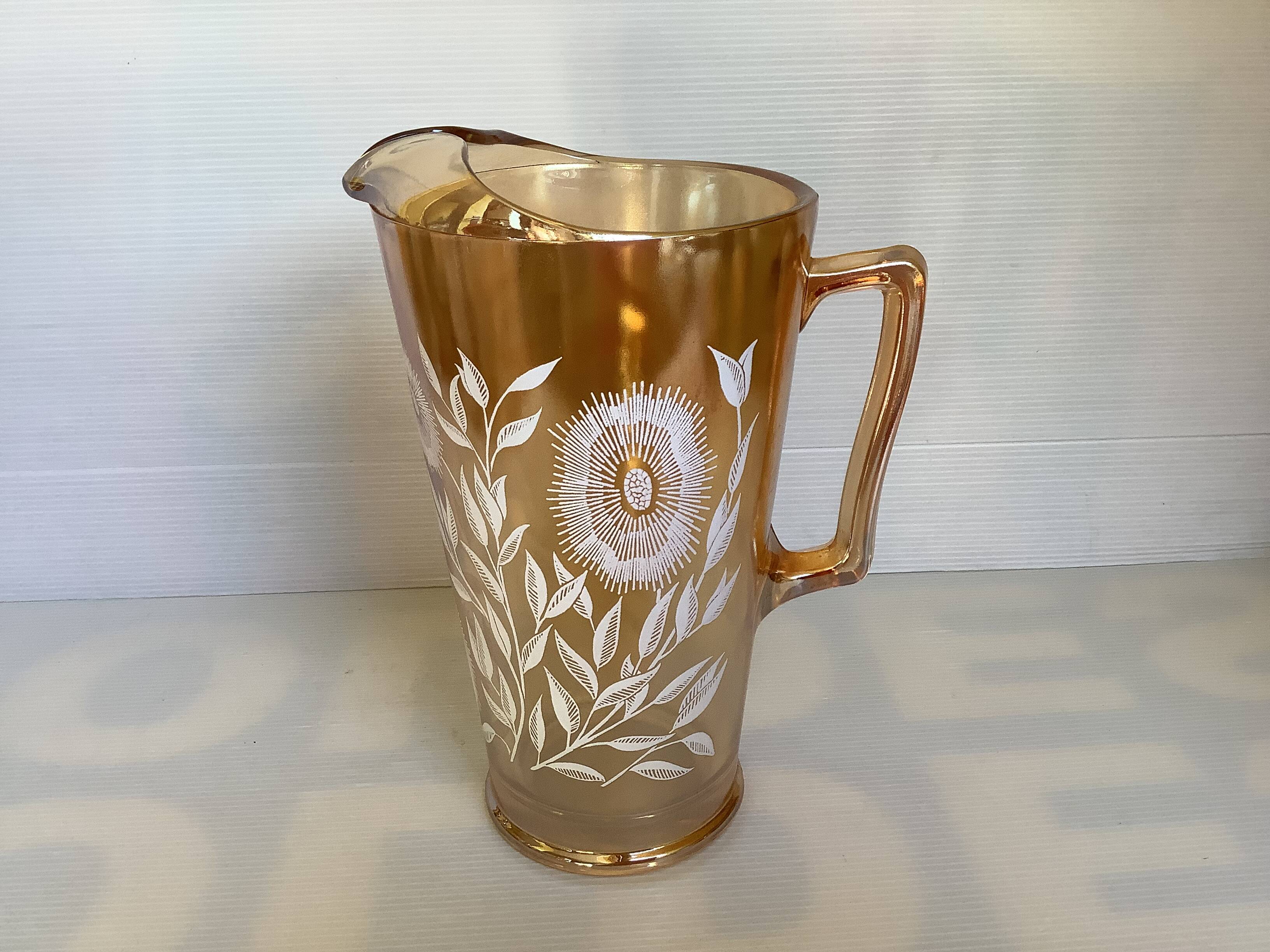 Service of marigold lemonade with iridescent reflections.