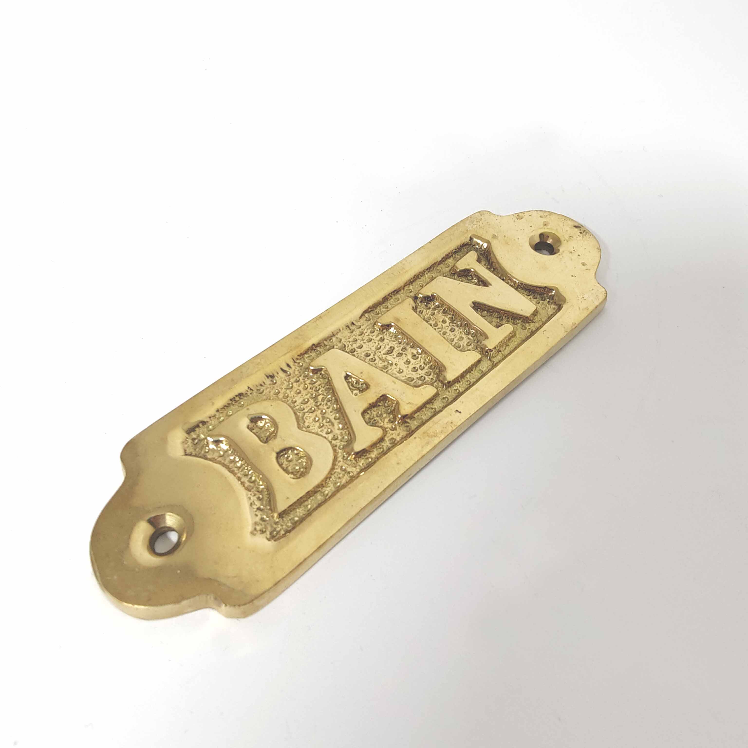 Brass bathroom door plate