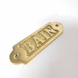 Brass bathroom door plate