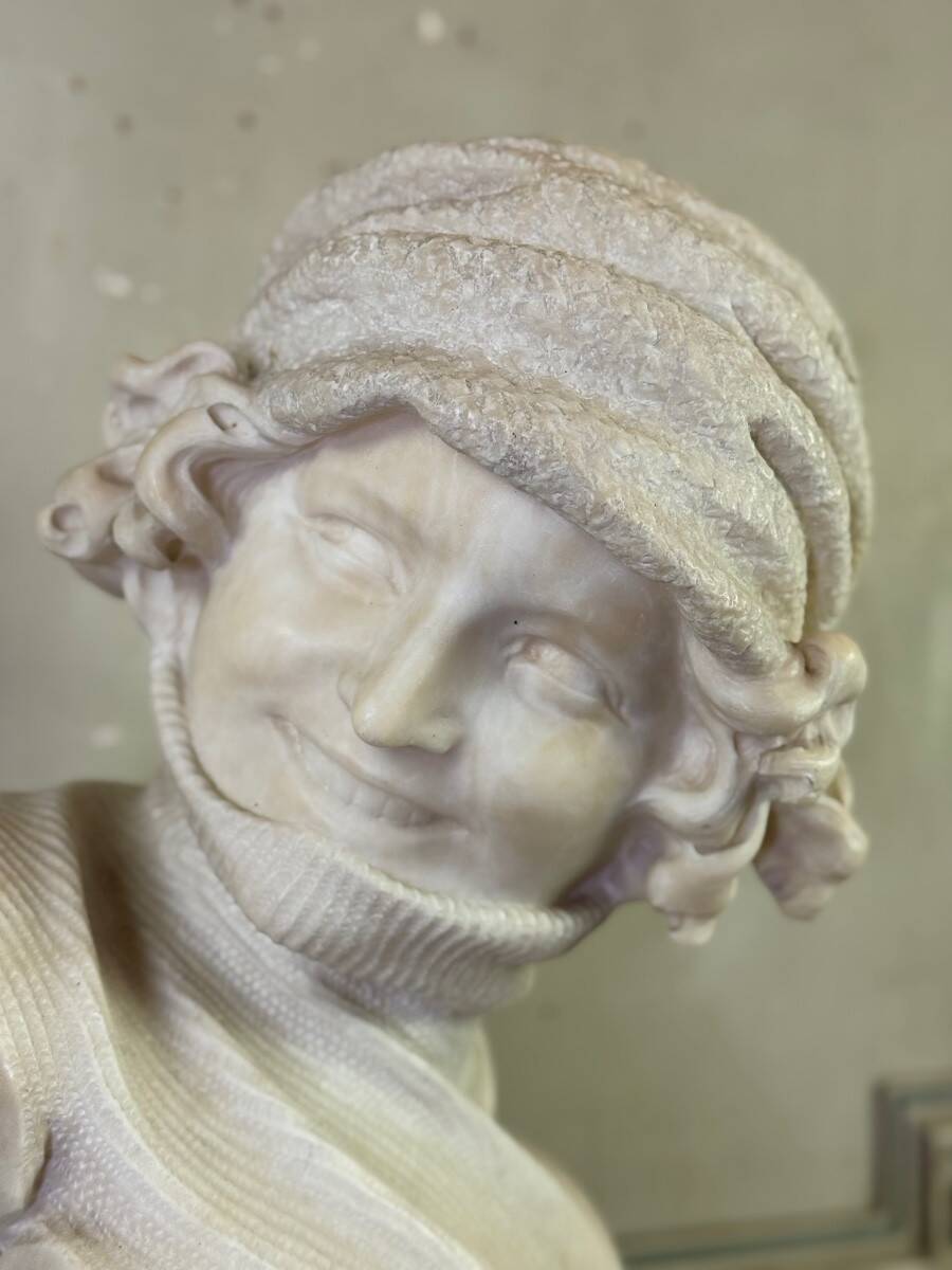 Alabaster bust of a young girl with a turtleneck, signed Caloni, Italy circa 1900