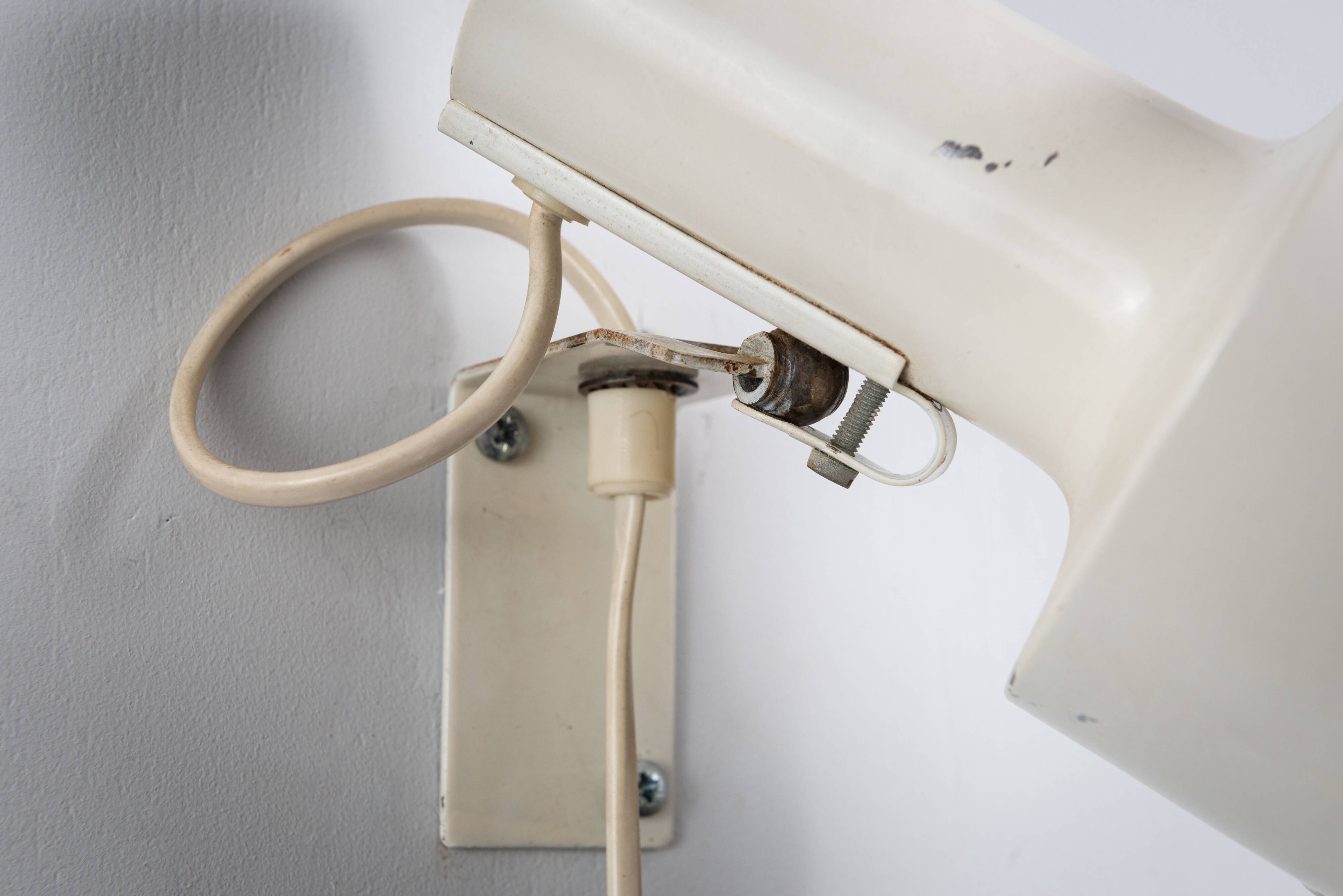 Pair of adjustable wall lamps designed by Per Sundstedt for Kosta Lampan