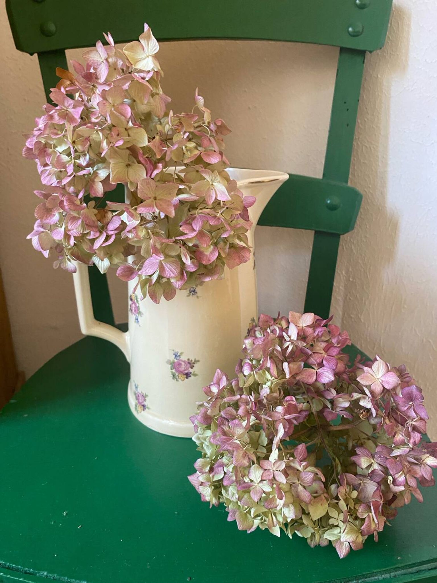 Old flowery and gilded pitcher.