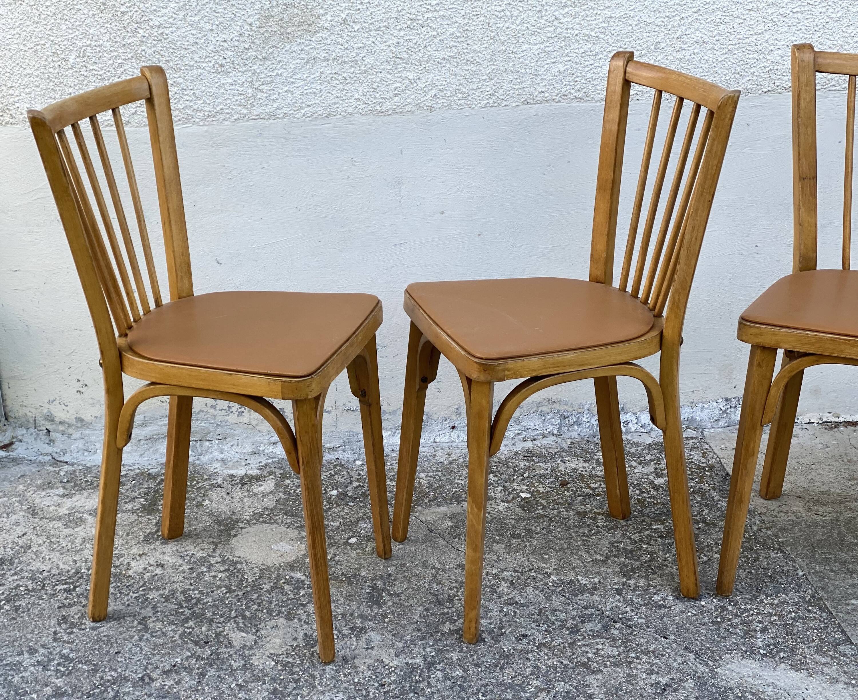 Série de 4 chaises bistros vintage 1950-60 assises Skaï