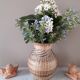 Vintage vase in sandstone and straw wicker