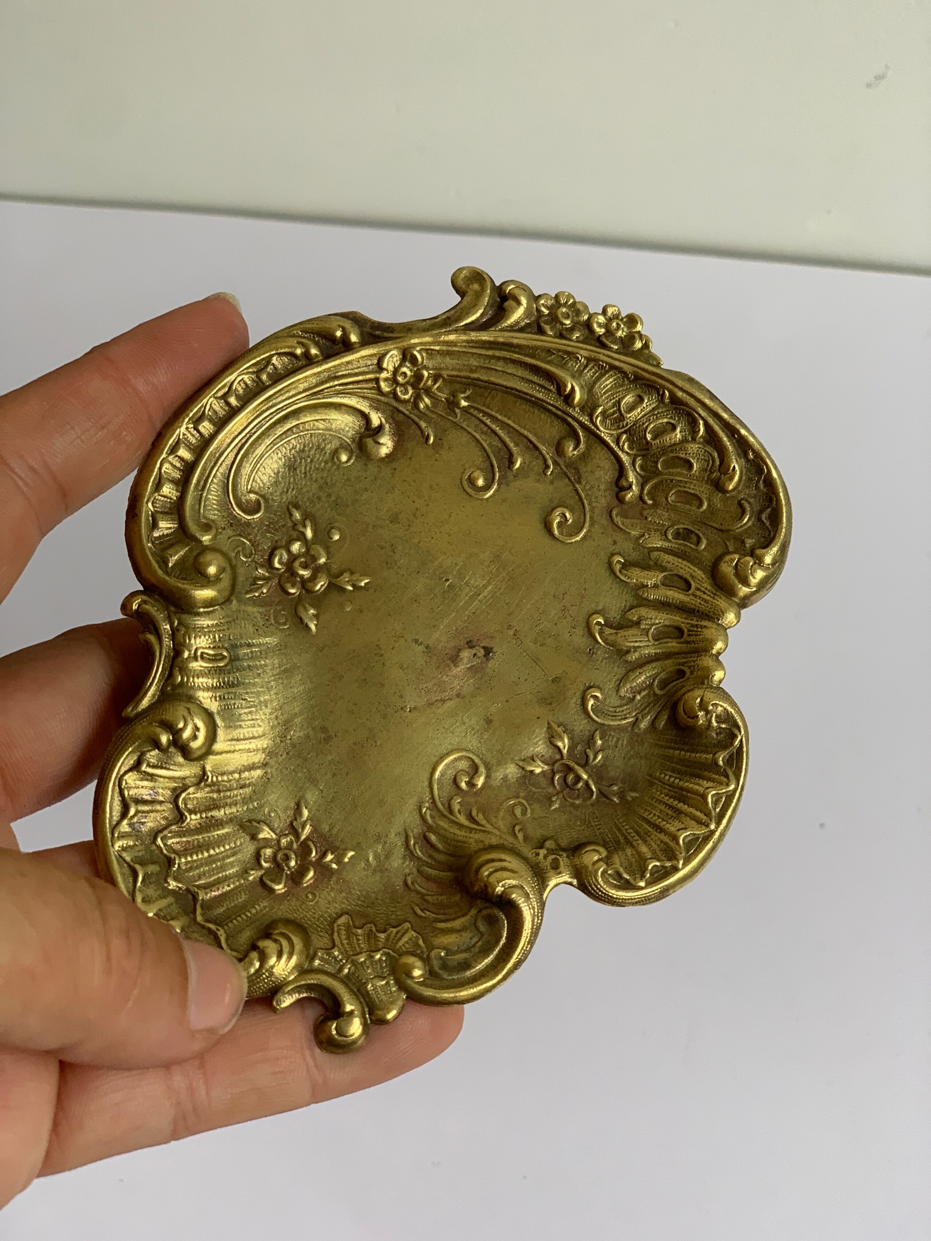 Empty art nouveau brass pocket