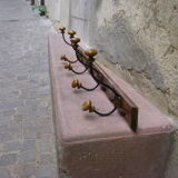 Wall coat rack has four hooks