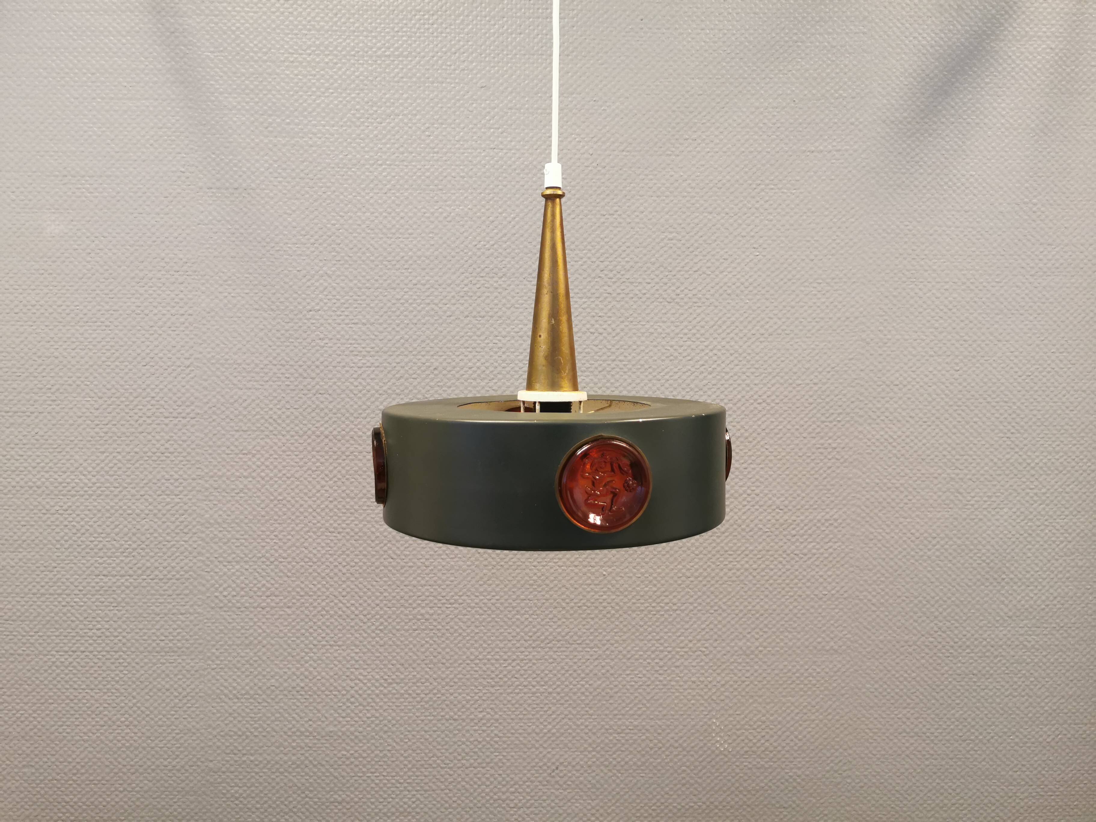 Swedish hanging lamp, in dark green lacquered metal with red glass prisms and brass top/suspension.