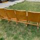 Banquette cinéma vintage 4 places marron en hêtre verni style Mid-Century années 1950