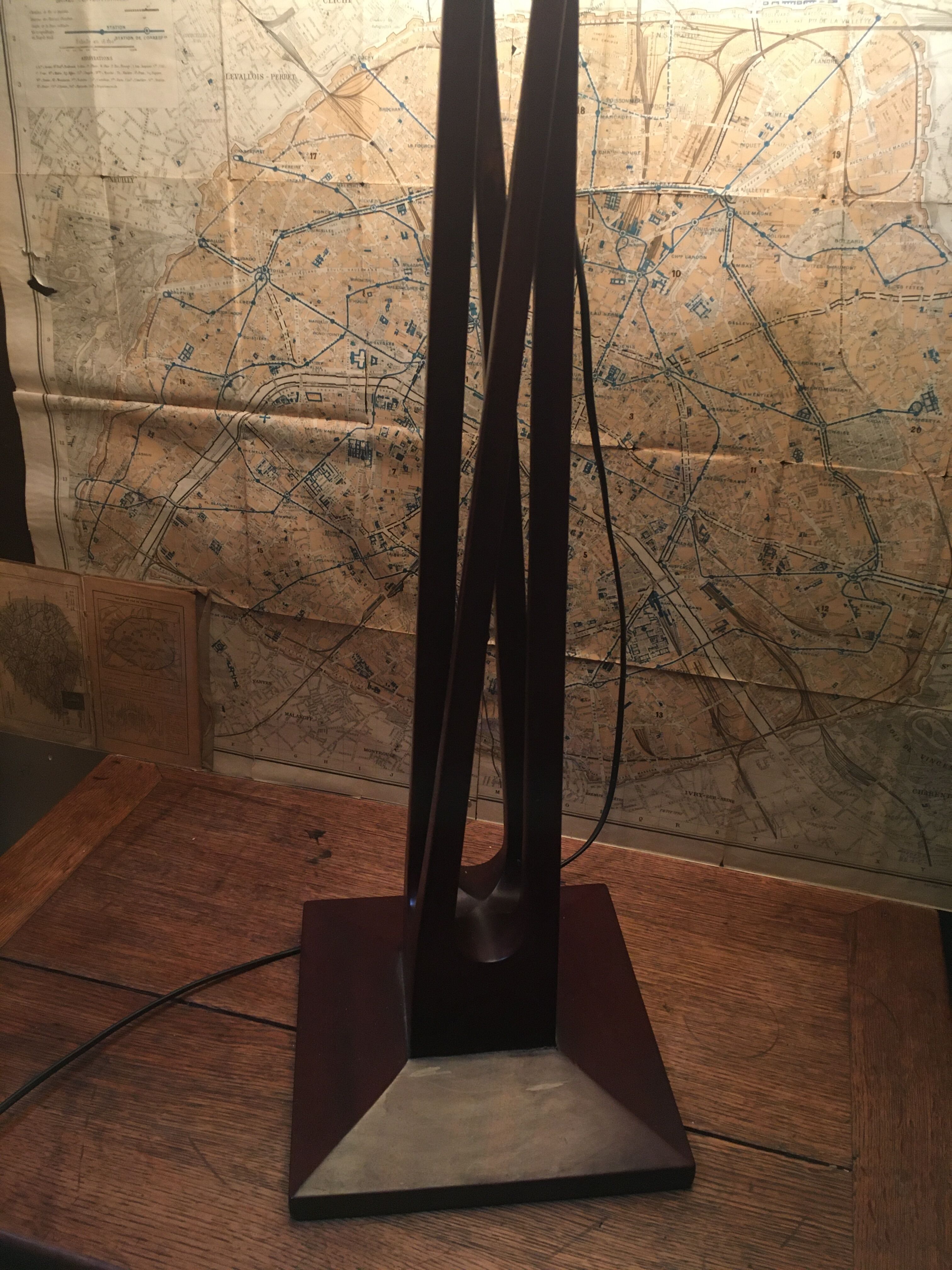 Mahogany lamp with a sculpted base.