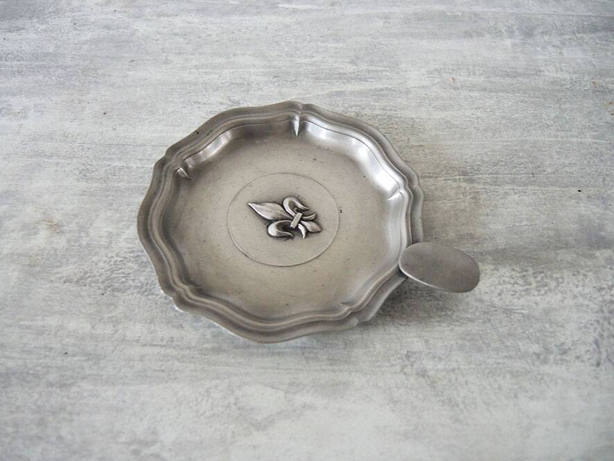 Old fleur de lys ashtray in pewter