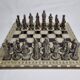 Vintage chess set in patinated metal alloy with a 39 cm chessboard from the 1980s.