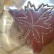 Silver tray with maple leaves in stainless steel.