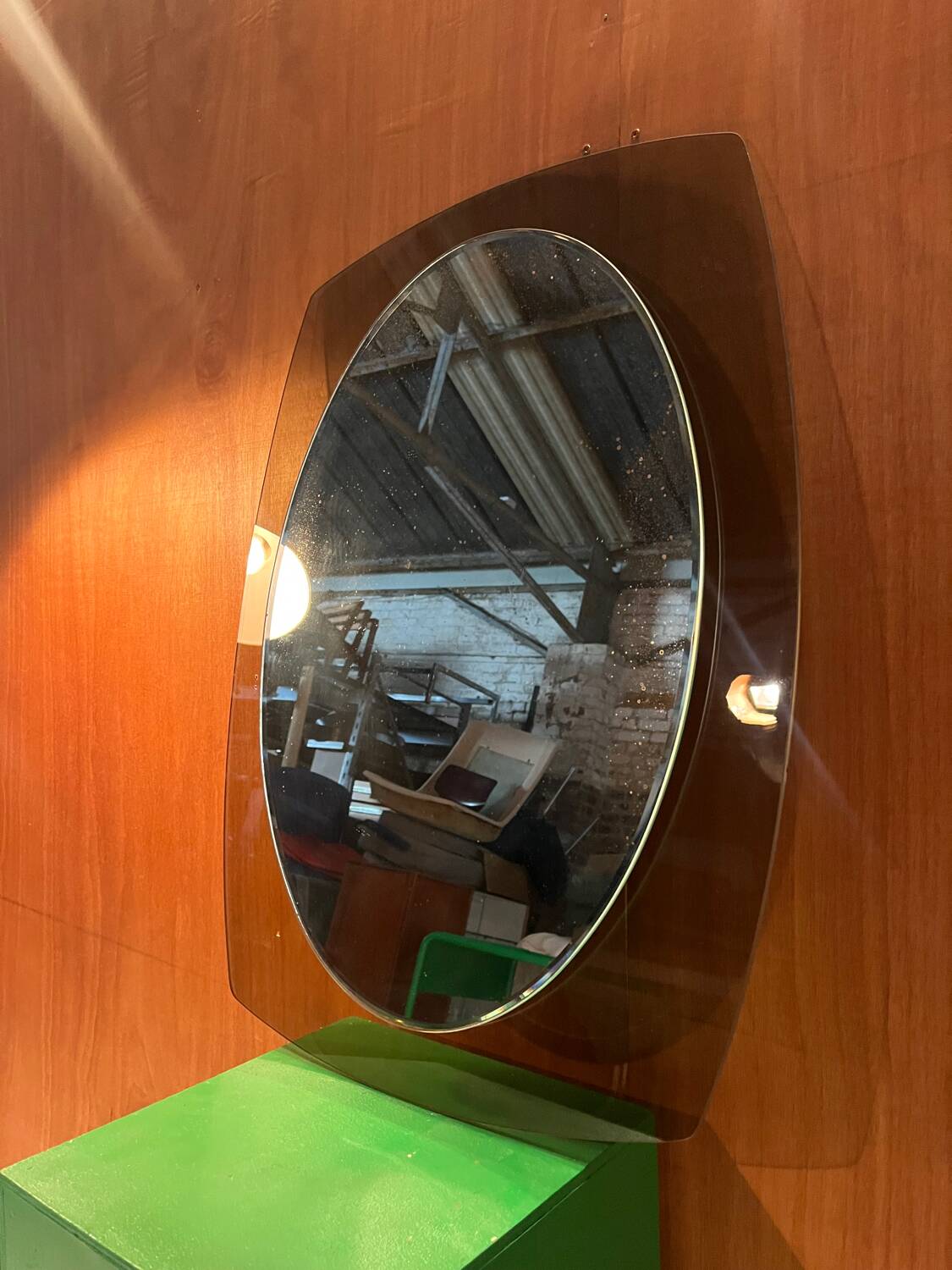 Vintage smoked glass mirror from around 1970.