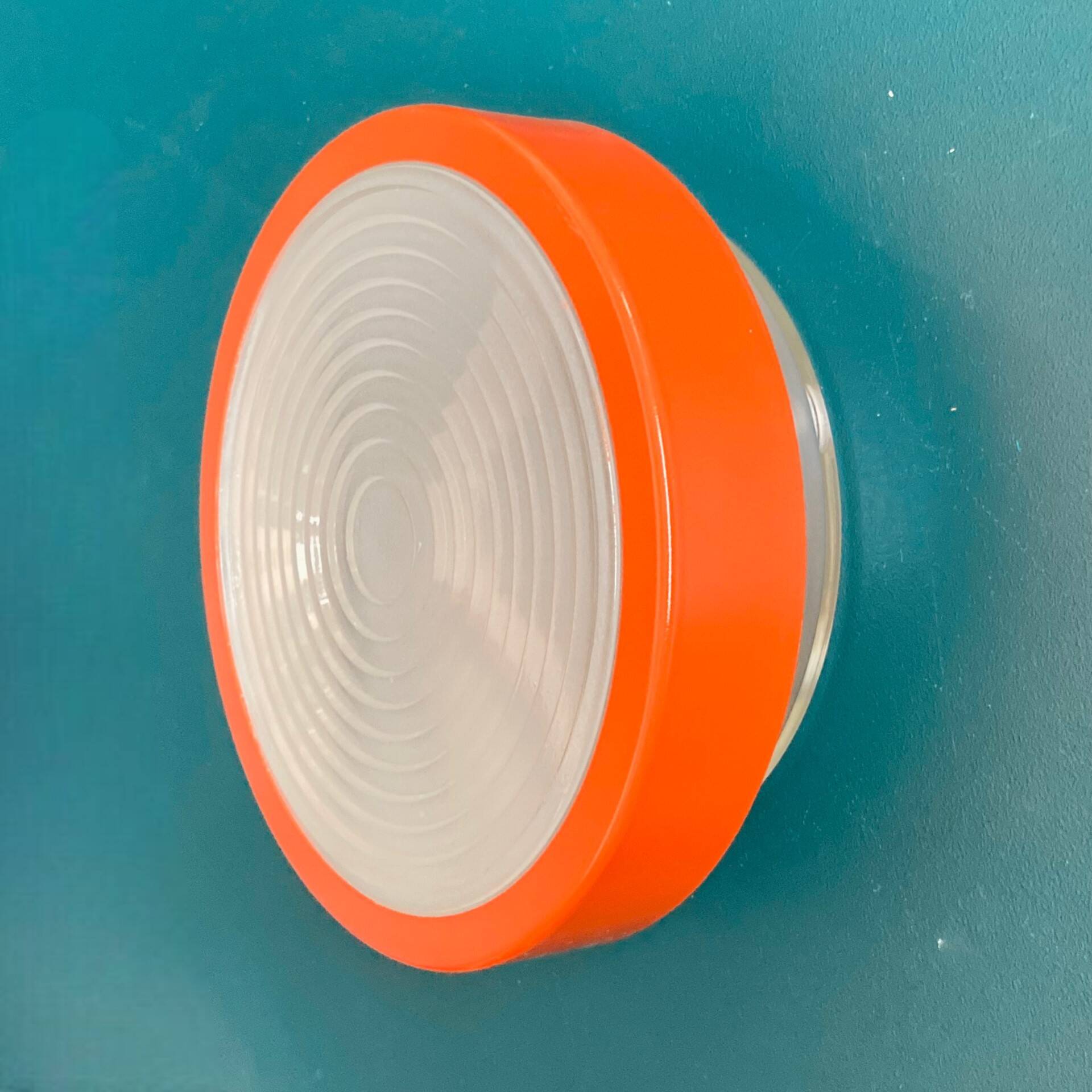 Large round Holophane wall lamp in glass and orange metal, industrial vintage decoration