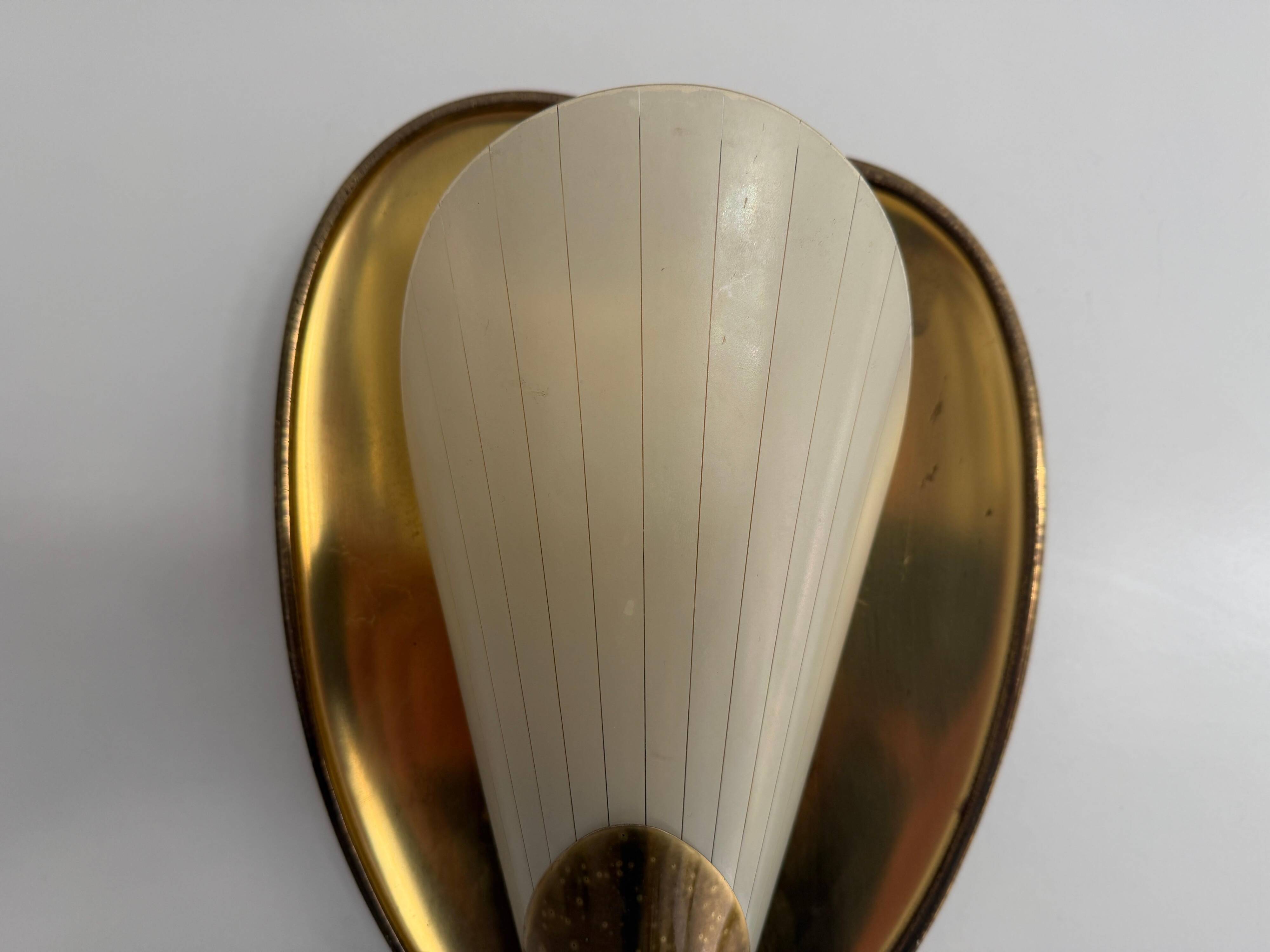 Pair of brass and glass wall lights from the mid-century, 1950s, Germany.