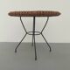 Rattan table with metal leg