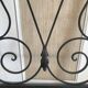 Wrought iron coat rack and shelf