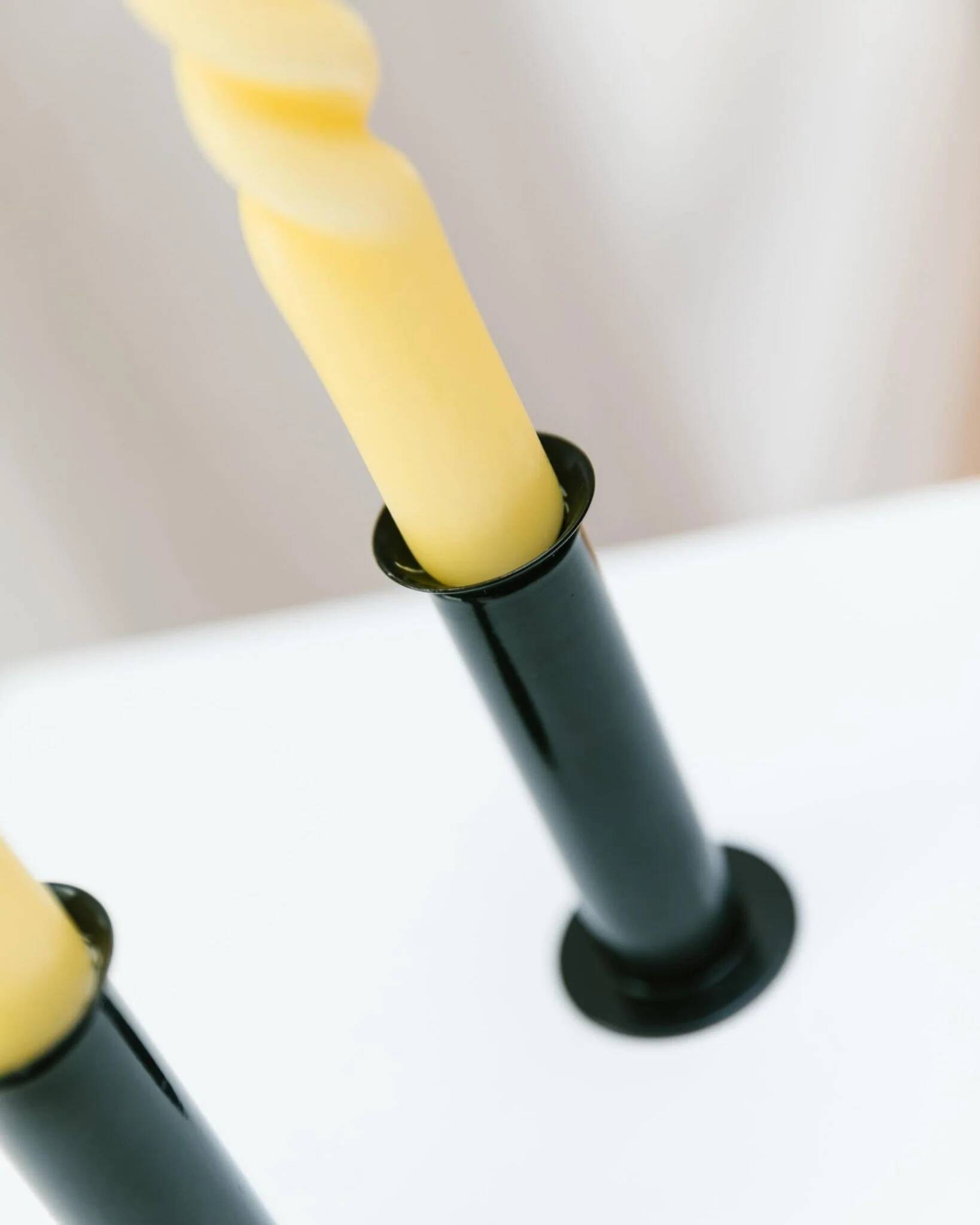 Set of 2 glossy black metal candleholders in retro Ikea Memphis style