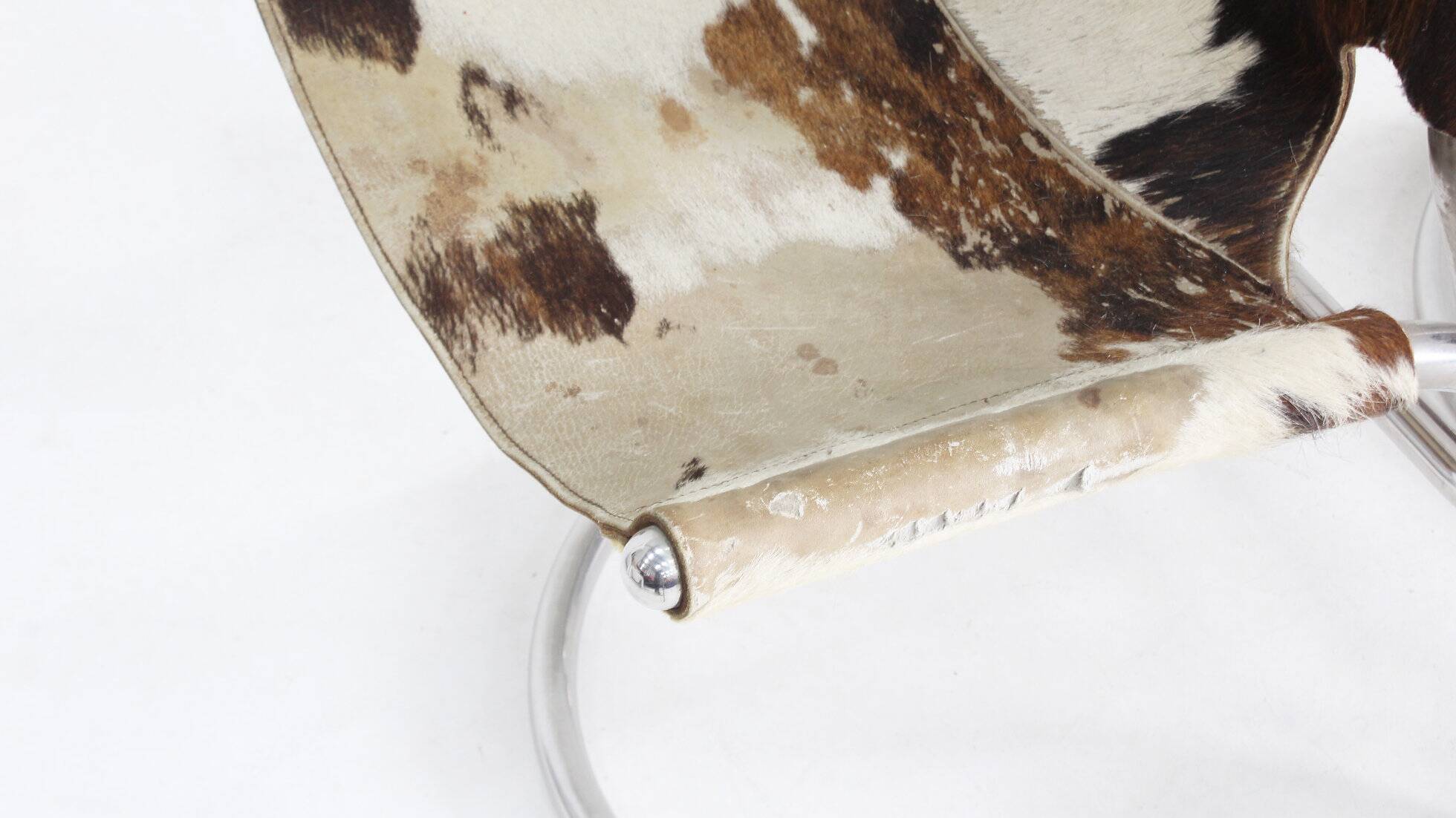 Vintage dining room chairs chrome and cowhide by Parravicini Fratelli