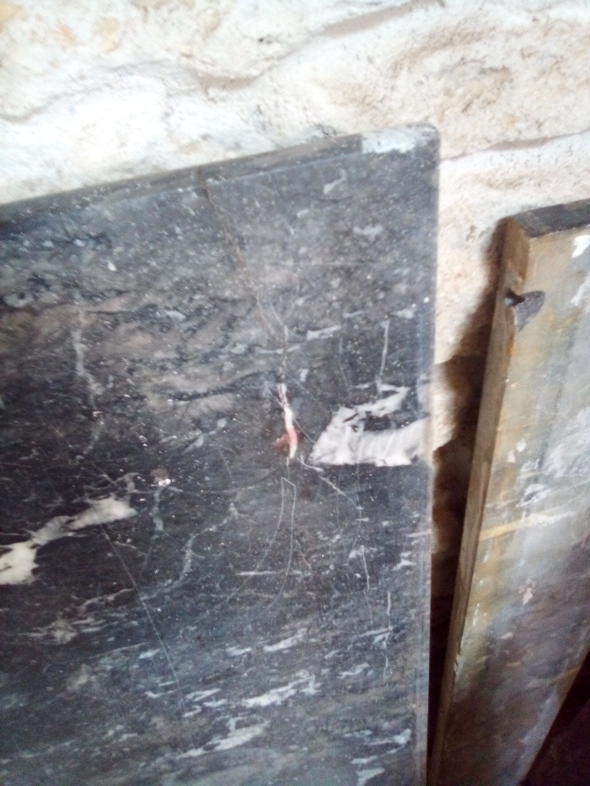 White veined black marble fireplace