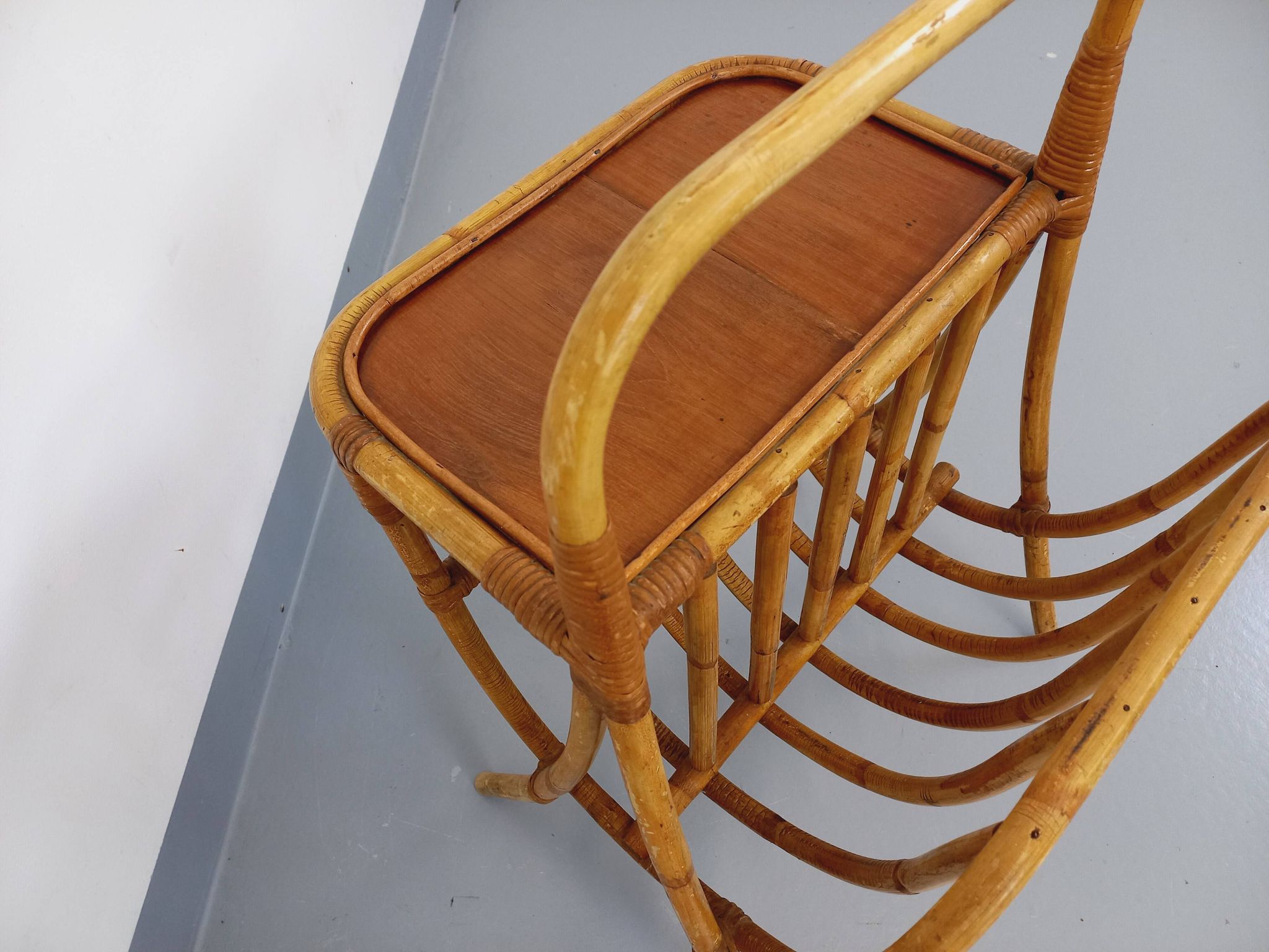 Side table with vintage rattan and wood magazine rack from the 60s