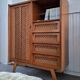 Vintage rattan cabinet with compass feet, old wicker chest of drawers