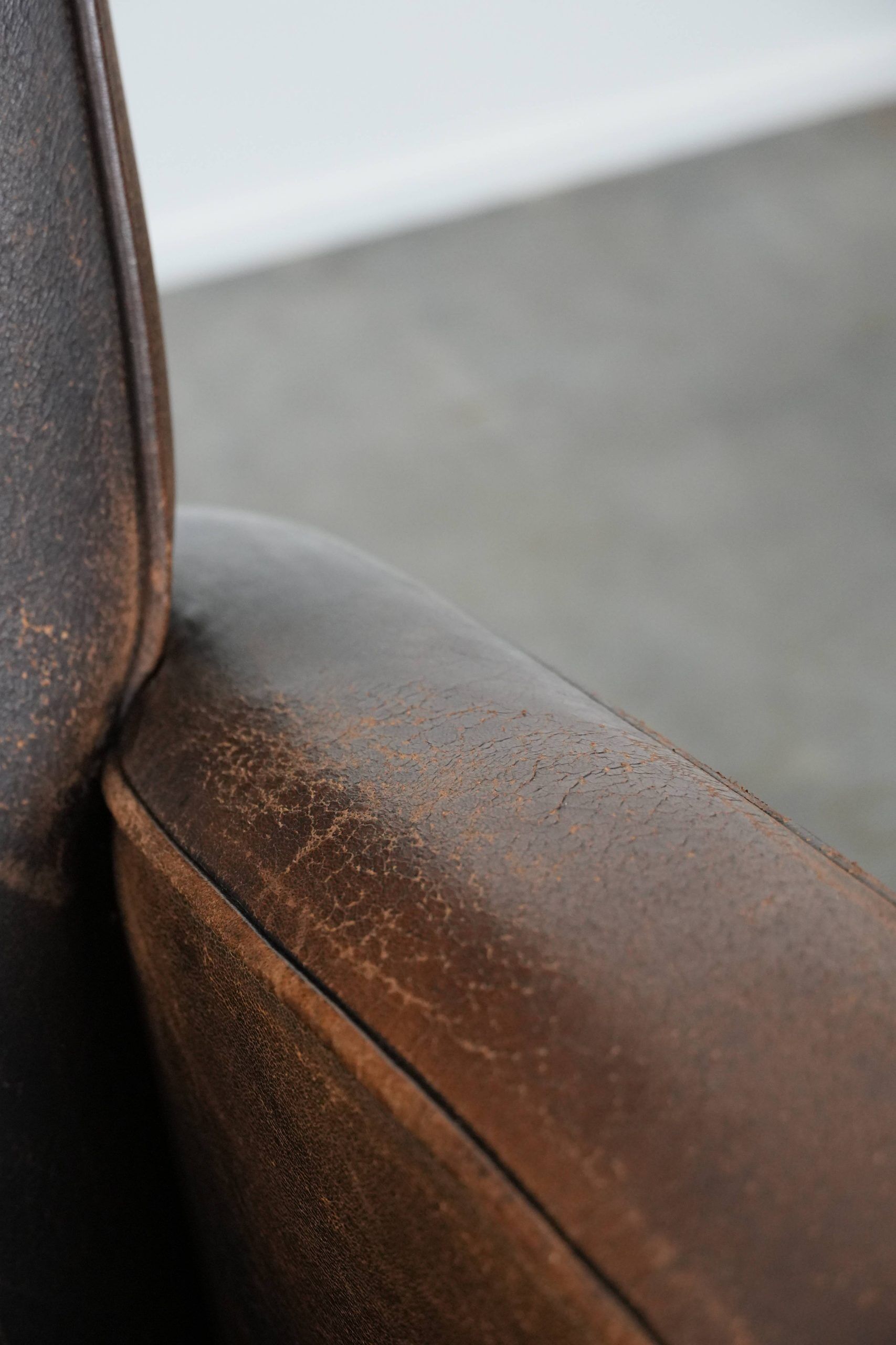 Set of two vintage sheepskin leather design armchairs in a cognac colour