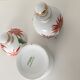 Y. Ginther porcelain jar and toilet jar