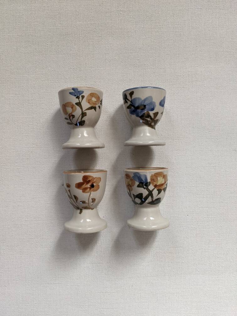 Ceramic egg cups with hand-painted floral decoration, stoneware, bohemian countryside