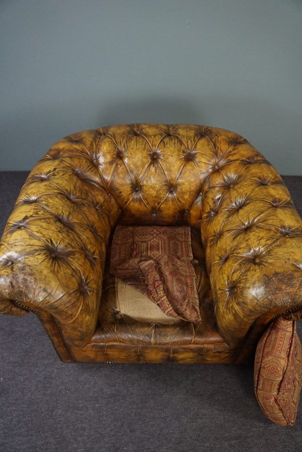 Patinated Chesterfield armchair
