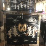Asian lacquer cabinet with mother-of-pearl relief pattern