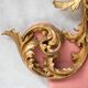 Italian rococo-style headboard in carved gilded wood, 19th century.