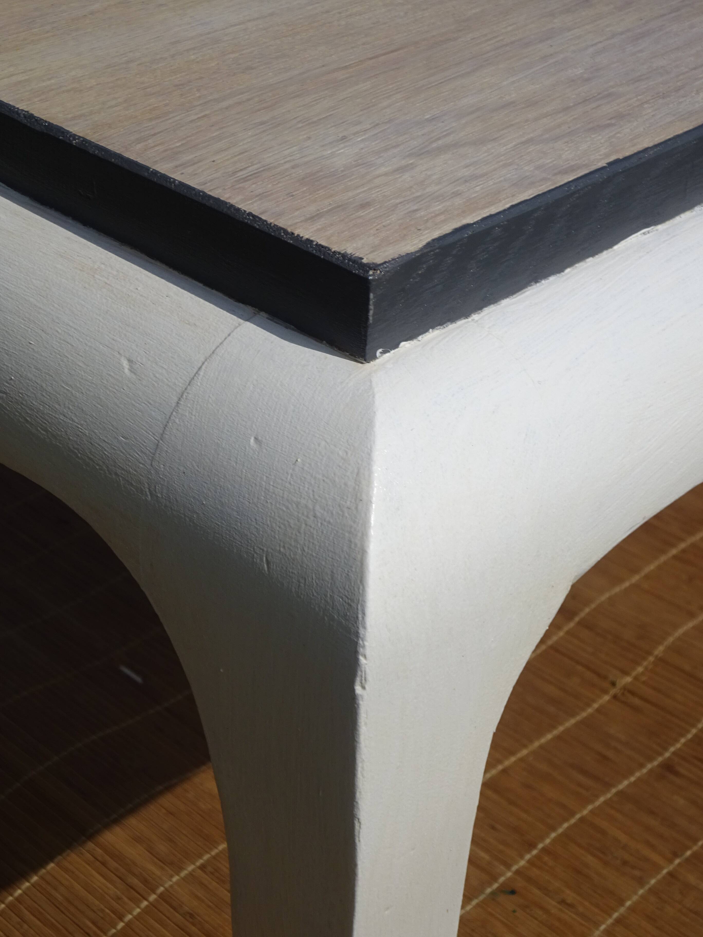 Oak coffee table with curved legs.