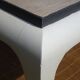 Oak coffee table with curved legs.