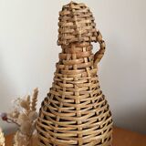 Bouteille en verre et rotin vintage