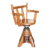 Antique captain's swivel chair on a draft horse wheel from around 1760.