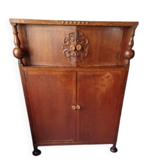 Antique carved oak placard in brown, late 19th century, with decorative panels and turned uprights.