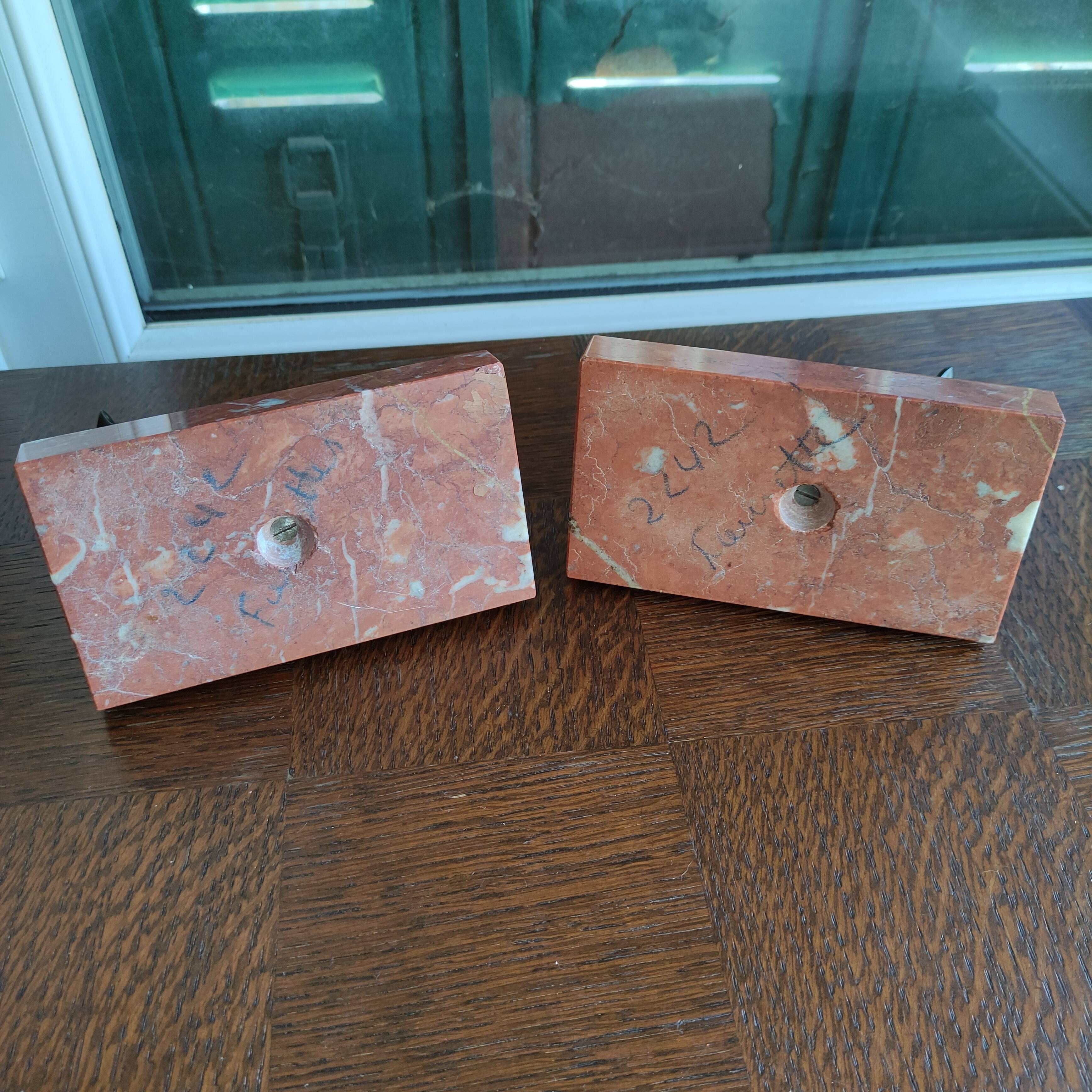 Zinc art bookends in the shape of birds on red marble - warblers