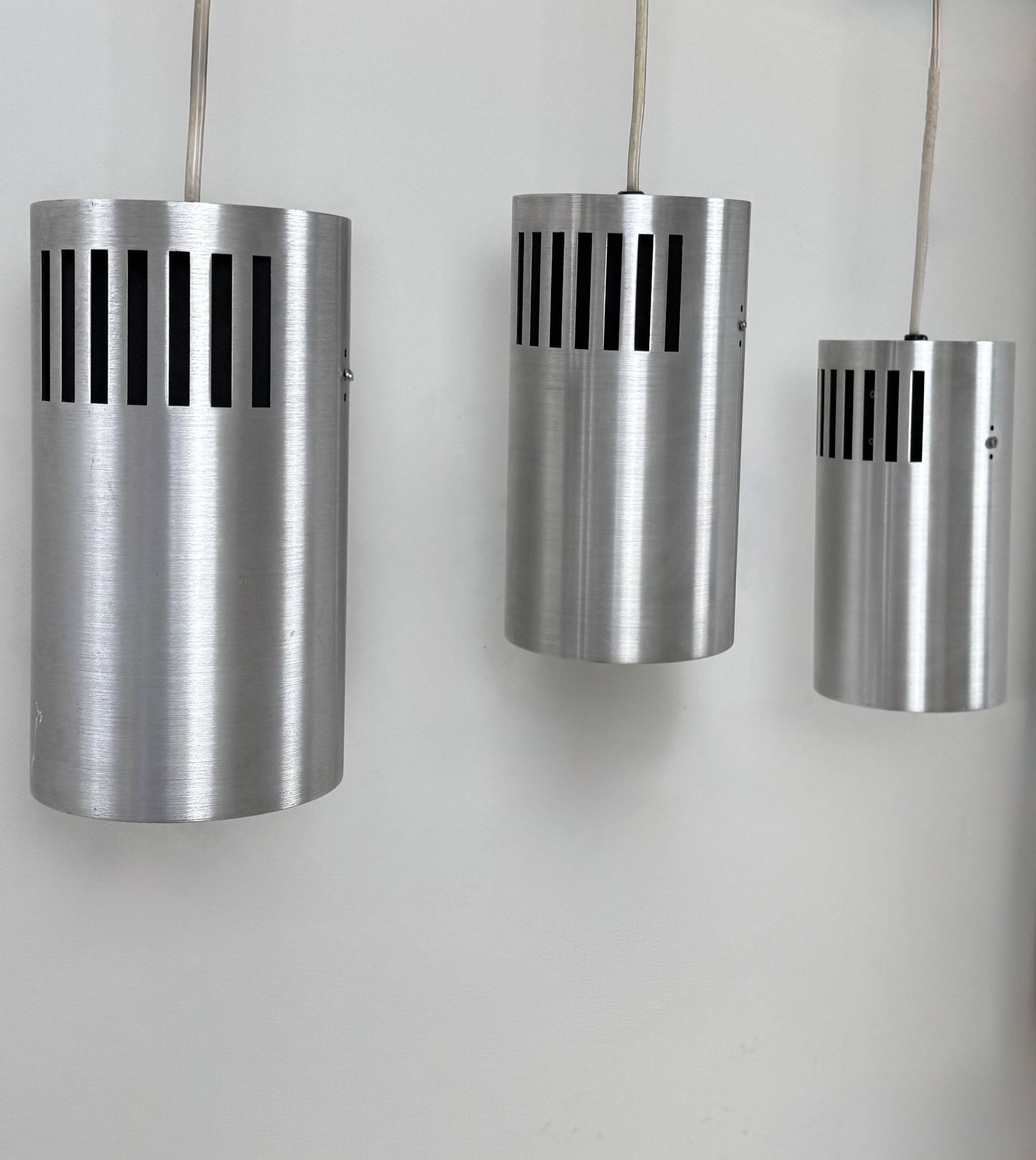 Set of 3 vintage brushed metal pendants, France, 1970.